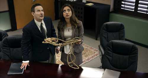 Henry (Eddie Jemison) and The Temp (Noureen DeWulf) contemplate the possibility of murder in Coffee, Kill Boss.
